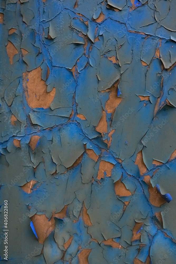 Rough textured blue wall with stains, selective focus