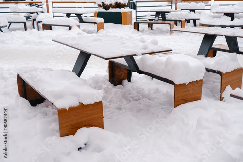 Wallpaper Mural Tables and benches of outdoor cafes, covered with snow. Torontodigital.ca