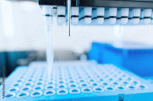Automation in the clinical laboratory. Pipetting robot laboratory. Medicine robotics. Research and science background