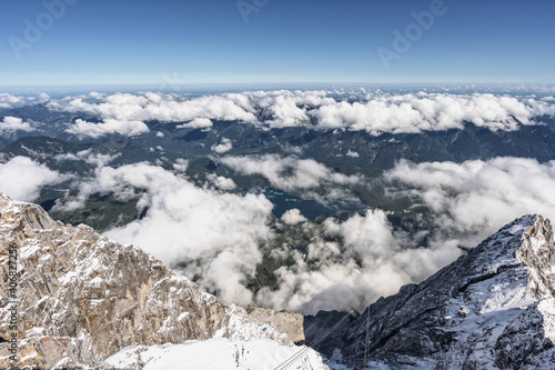 Snowy white Alpine mountain range in summer time on Zugspitze, top of Germany photo