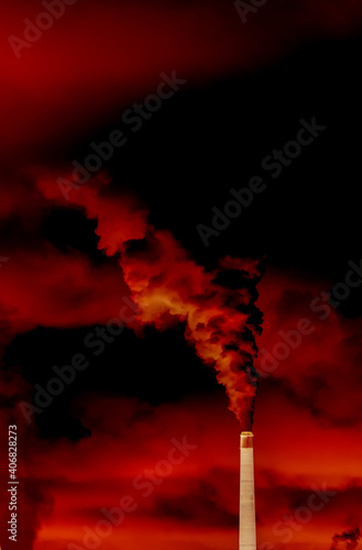Smokestack pouring out pollution into a vivid red sky