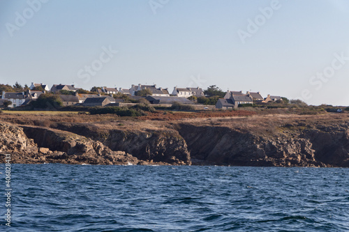 Coast and village in Brittany view from the sea photo