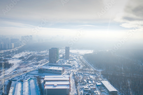 Moscow on a frosty winter day under the  blanket  of steam from the pipes of thermal stations.