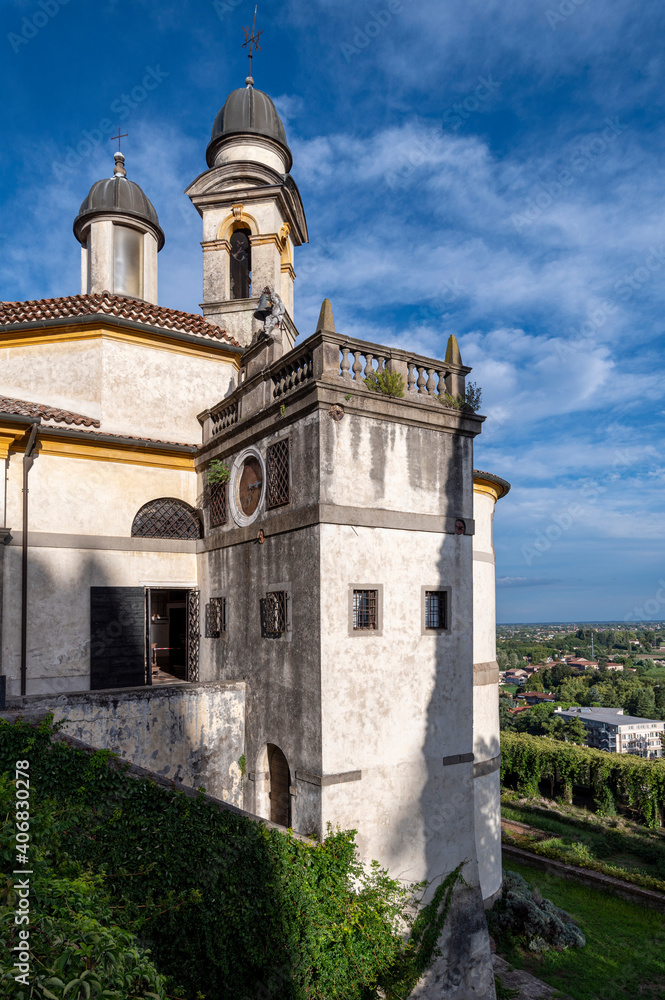 Sanctuary of the 7 Churches, architectural detail of the church of San Giorgio with the panorama on a summer day with blue sky and clouds, Monselice, Padua, Veneto, Italy.