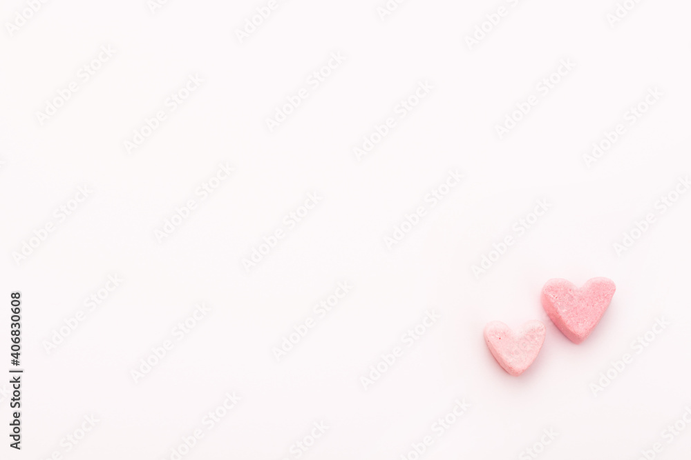 two little Sweet hearts on a pink background. Happy Valentines