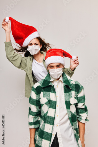 Christmas family holiday fun woman in santa hat and young man