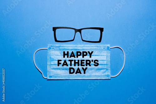 Silhouettes of a man with glasses and a surgical mask with letters. Father's Day concept during the Covid-19 pandemic.