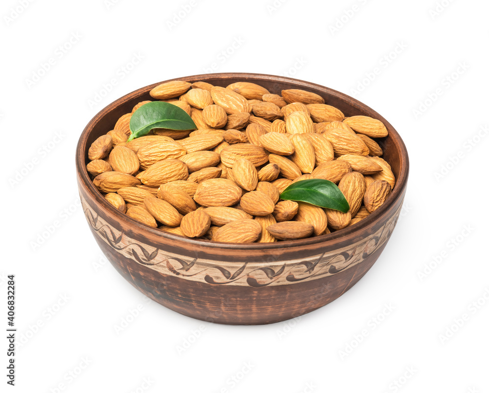 Almond nuts in bowl on white background Almond nuts in bowl on white background