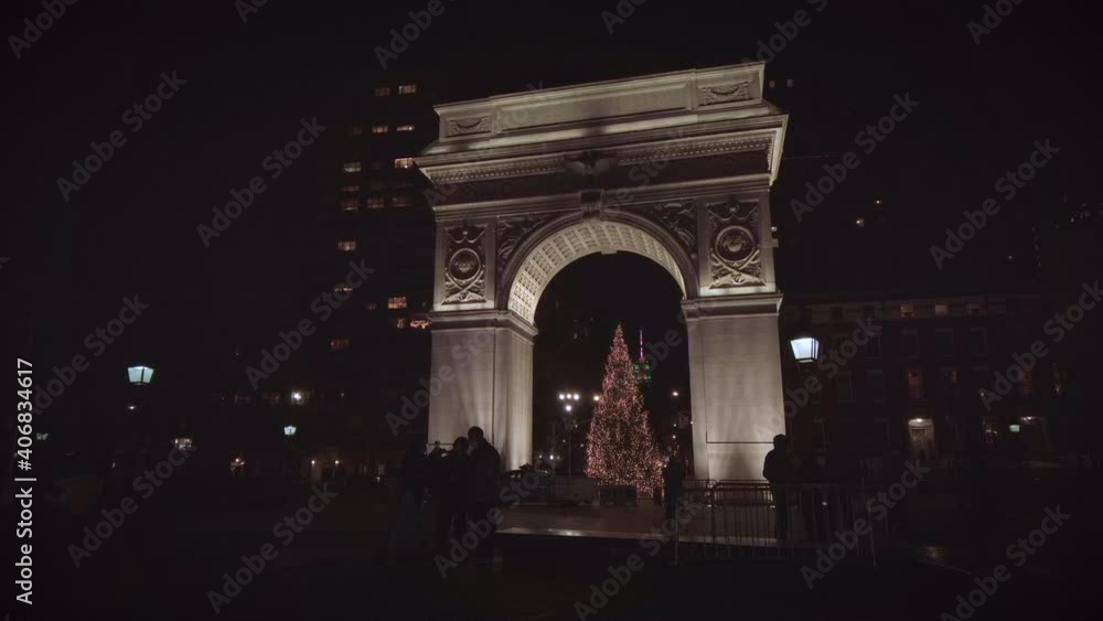 Washington Square Park Arch in downtown Manhattan by Washington Square Park during Christmas with a large illuminated beautiful Christmas tree. Filmed at night. Washington Square Park Arch in downtown Manhattan by Washington Square Park during Christmas with a large illuminated beautiful Christmas tree. Filmed at night.