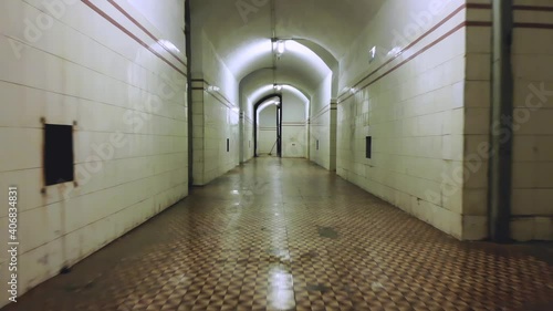 Civil War Bunker Hall. Reverse steady cam motion with person cleaning in the background