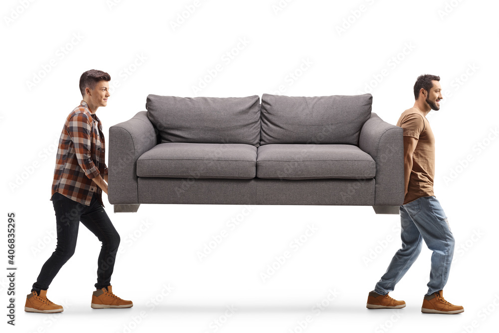 Young men carrying a gray sofa
