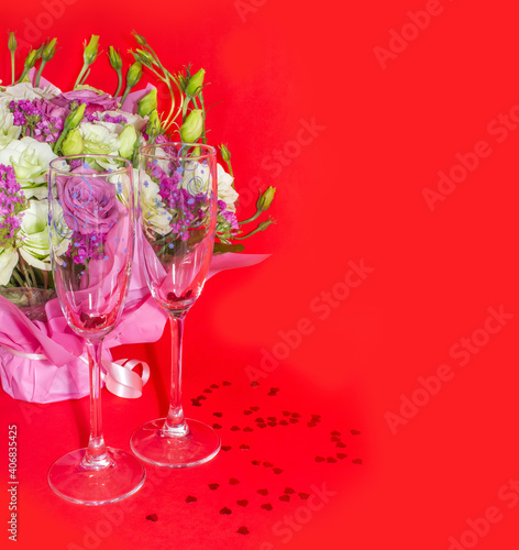 Background of Valentines day celebration with champagne glassses, flowers boucket, hearts glitter. photo