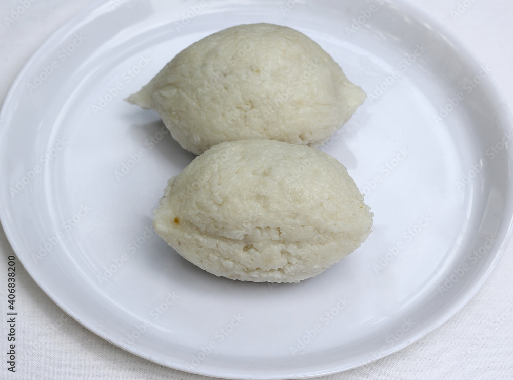 Selective focus on one of Imbul Kiribath,a cylindrical shape Sri lankan sweet dish made from rice,coconut milk and sweet filling Selective focus on one of Imbul Kiribath,a cylindrical shape Sri lankan sweet dish made from rice,coconut milk and sweet filling