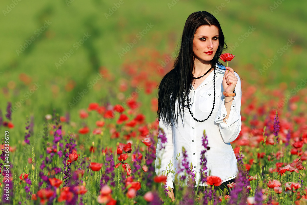 Young brunette beautiful gilrl enjoying the spring flowers Young brunette beautiful gilrl enjoying the spring flowers