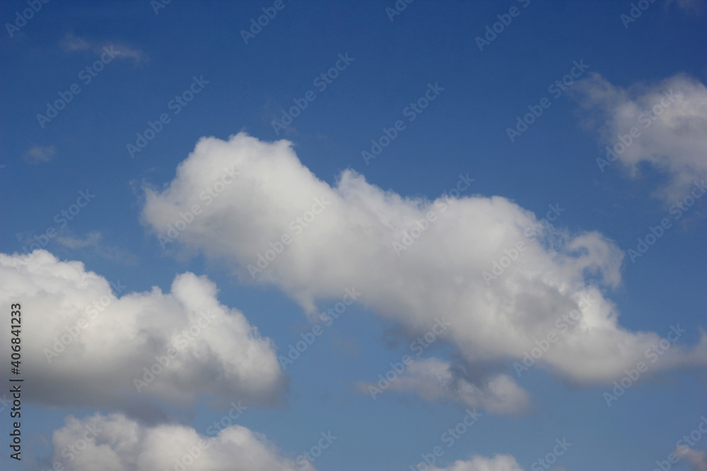Strangely shape white clouds in the blue sky Strangely shape white clouds in the blue sky