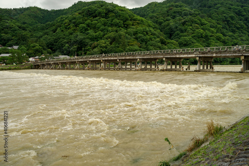 京都嵐山・渡月橋と増水した桂川の風景 photo