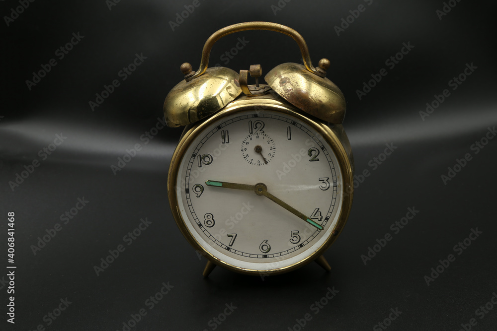 old alarm clock on black background old alarm clock on black background