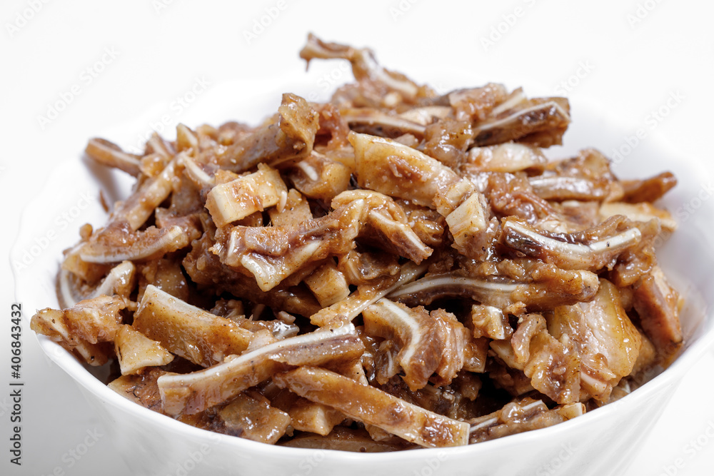 Appetizing beer snack - smoked pork pig ears on a board on a gray background Appetizing beer snack - smoked pork pig ears on a board on a gray background