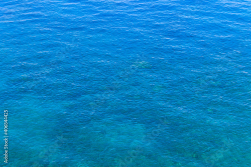 Blue water texture background. Surface of the sea © olyasolodenko