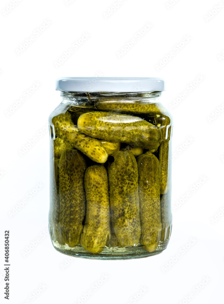The glass jar with cucumbers, isolated on white The glass jar with cucumbers, isolated on white