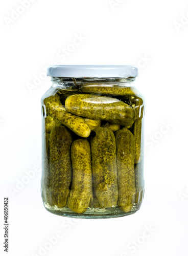 The glass jar with cucumbers, isolated on white