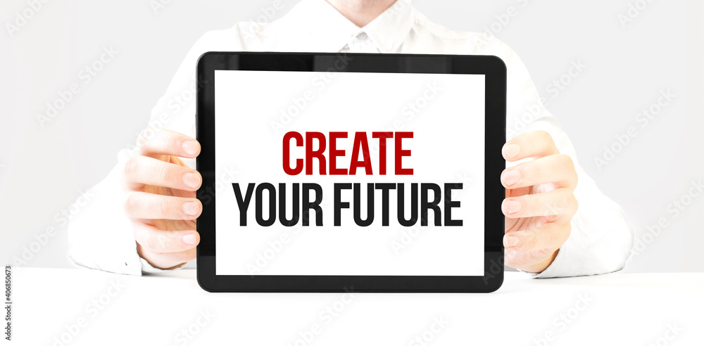 Text create your future on tablet display in businessman hands on the white bakcground. Business concept