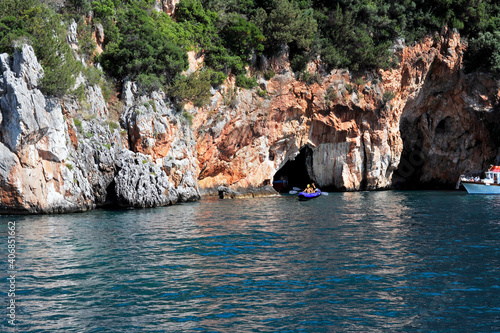 Excursionists, boaters, and canoeists visiting the grottos along the Cilento coastline.