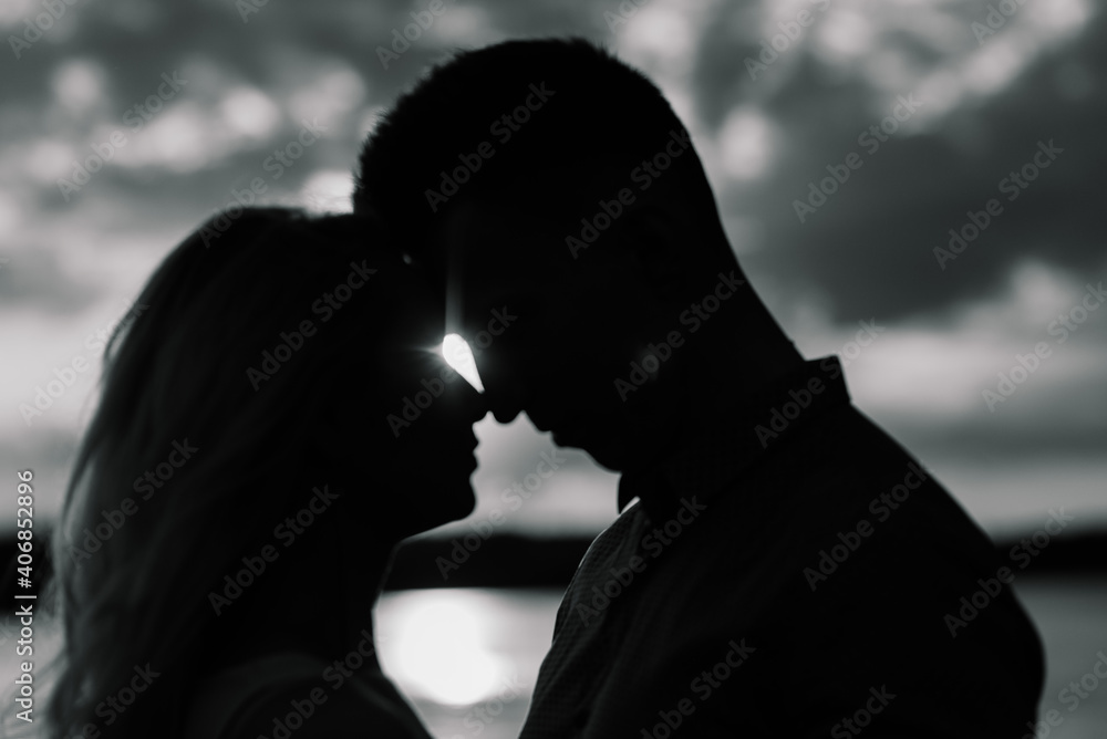 Loving couple kissing on the nature, summer evening