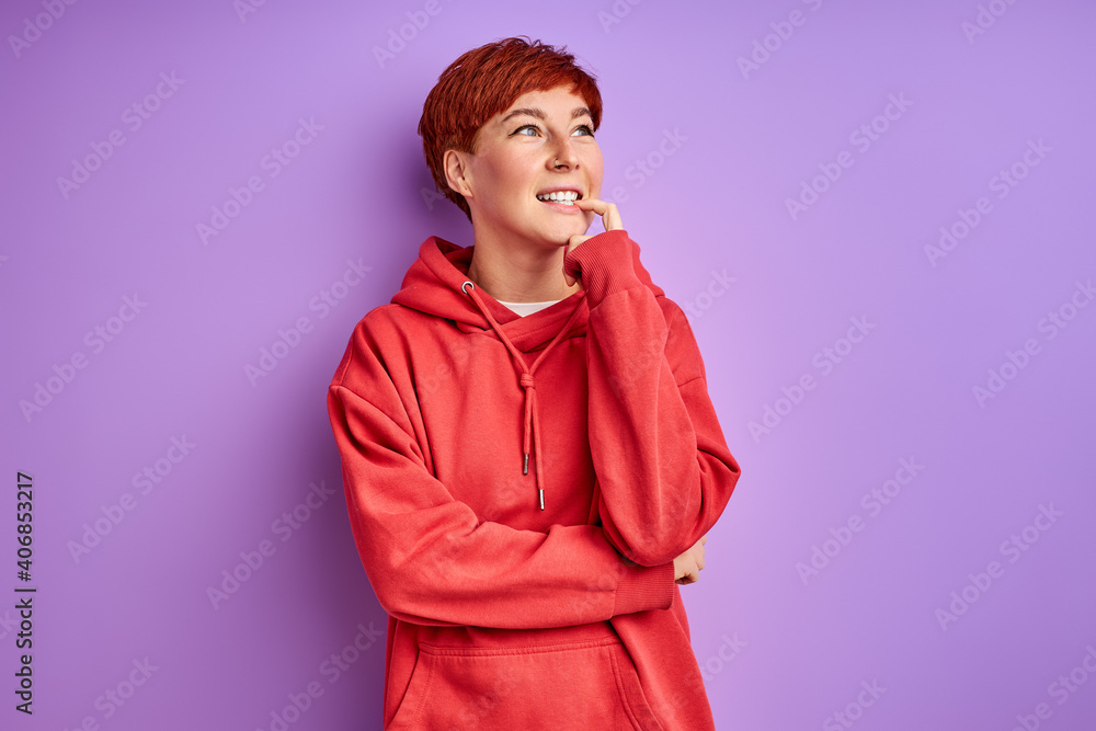 thoughtful female with red hair stand thinking looking up, people and human emotions concept thoughtful female with red hair stand thinking looking up, people and human emotions concept