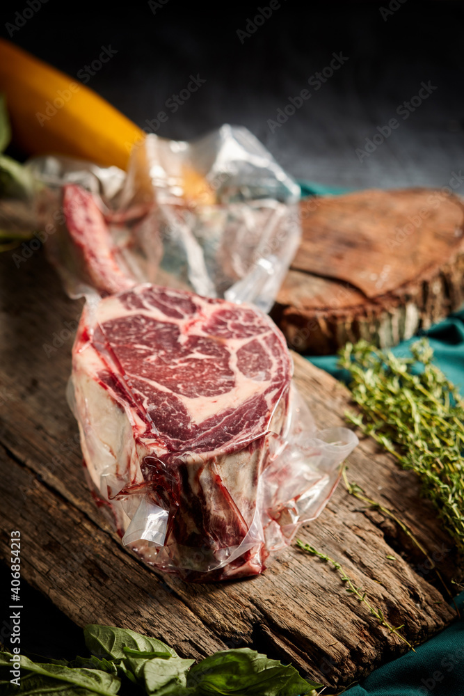 Steak the Tomahawk rests on a vacuum packed Steak the Tomahawk rests on a vacuum packed