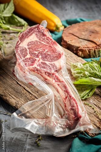 Steak the Tomahawk rests on a vacuum packed