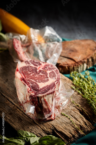 Steak the Tomahawk rests on a vacuum packed