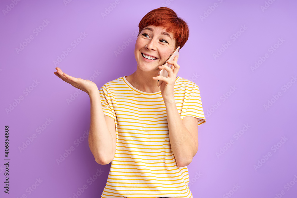 woman talk on phone sharing news with friend, isolated over purple background woman talk on phone sharing news with friend, isolated over purple background