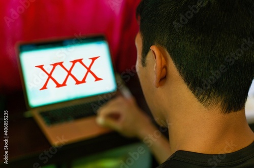 Obraz na plátně Man watching porn on his computer. Pornography addiction.