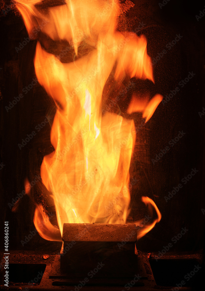 flames in a pellet stove flames in a pellet stove