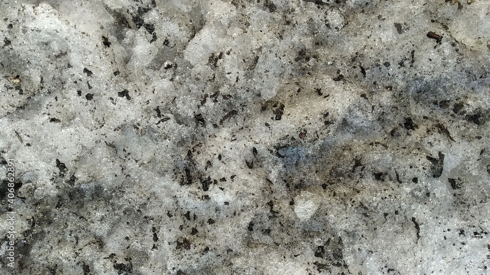 dirty snow texture in the ground- closeup rough pile in the street with black and gray parts during winter dirty snow texture in the ground- closeup rough pile in the street with black and gray parts during winter