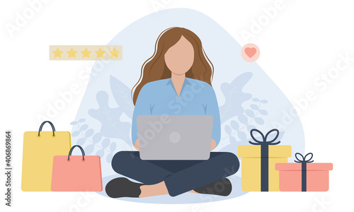 Seated woman with laptop, presents and shopping bags. Concept for online shopping.