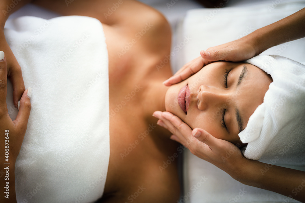 woman getting spa facial spa massage treatment at beauty spa salon woman getting spa facial spa massage treatment at beauty spa salon