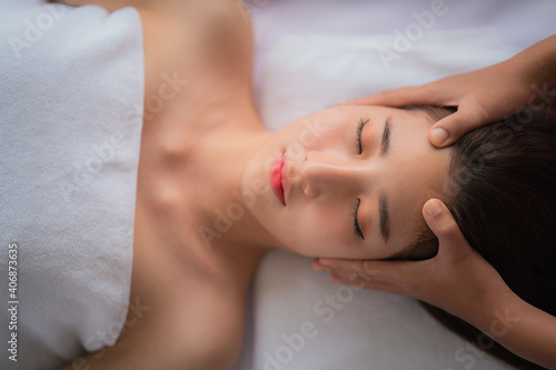 woman getting spa facial spa massage treatment at beauty spa salon © Mongkolchon
