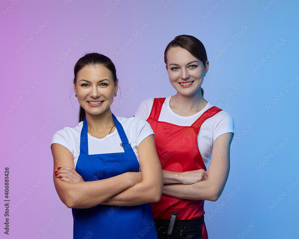 two girls-hairdressers in the studio. Asian and Caucasian appearance. two girls-hairdressers in the studio. Asian and Caucasian appearance.