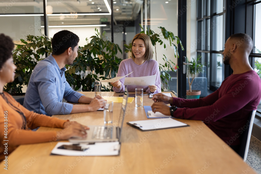 Diverse group of business people working in creative office Diverse group of business people working in creative office