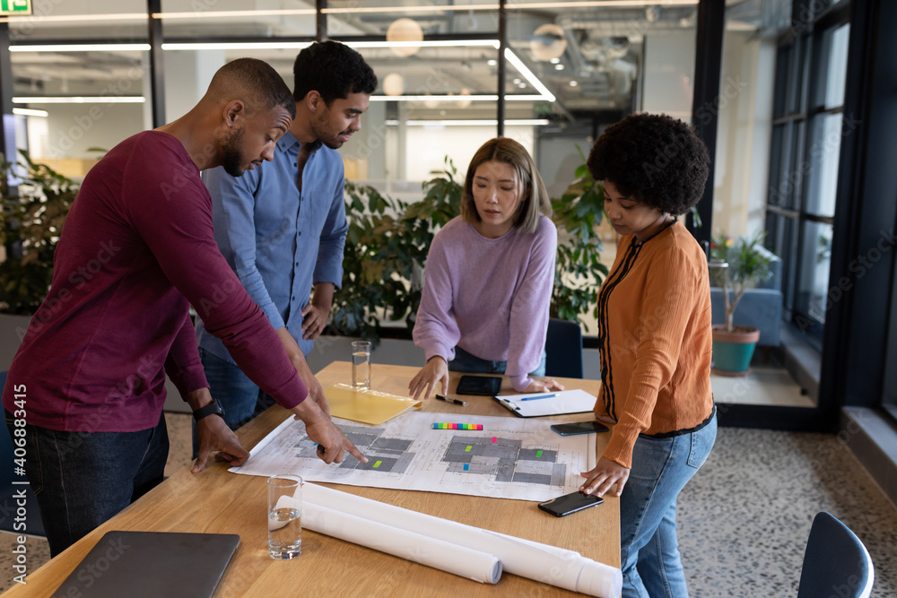 Diverse group of business people working in creative office Diverse group of business people working in creative office