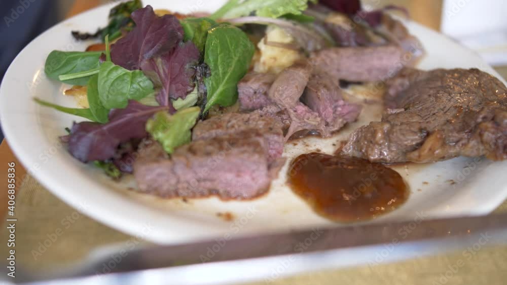 dipping some steak in chutney sauce dipping some steak in chutney sauce