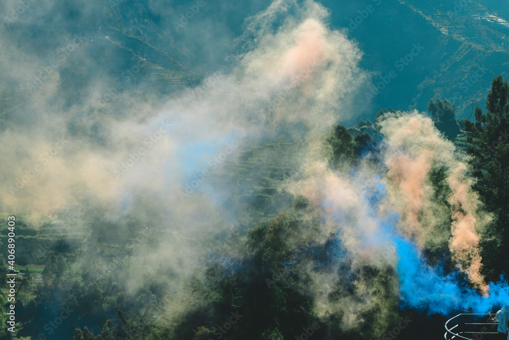 Colourful smog with orange and blue with nature background