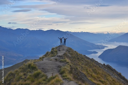 New Zealand  welcoming a new day from Roys Peak. The view to Lake Wanaka and mountains around is just breathtaking  This track is popular one day hike and definitely worth it.