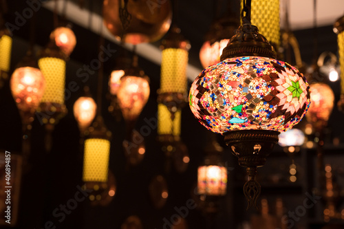 Colorful lamp on celebration festival.Arabic lamp lighting with colors on muslim lantern shining in the cafe and restaurant. photo