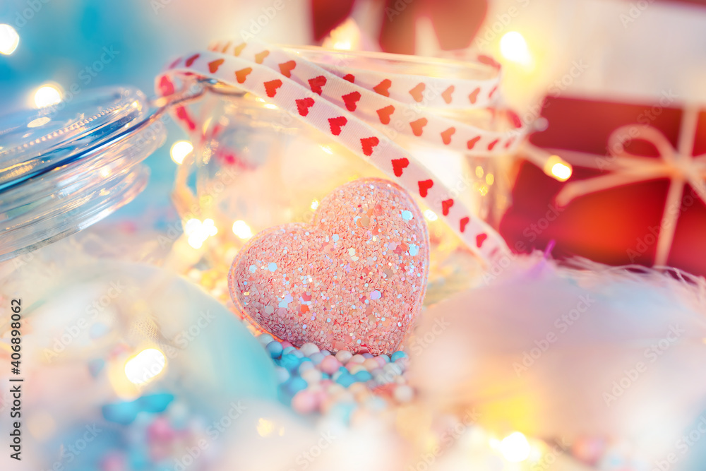 heart shape, Foam beads, feather, gift box and light decorative bokeh on blue cloth. Love, Valentine and holiday concept. heart shape, Foam beads, feather, gift box and light decorative bokeh on blue cloth. Love, Valentine and holiday concept.