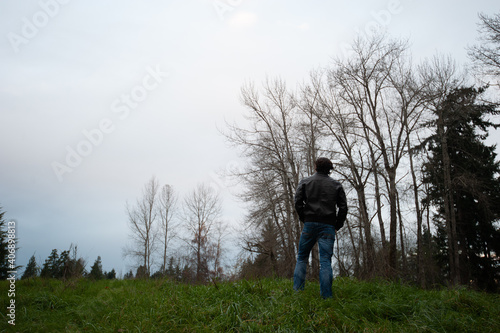 person on a mountain overlooking the scenery