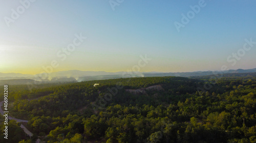 Top view of mountains with green forest.