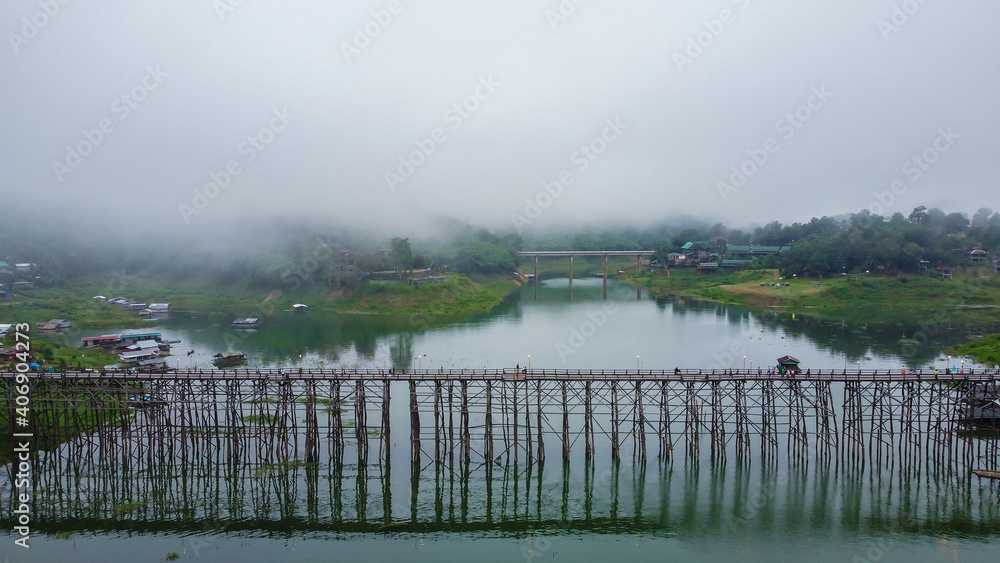 Αυτοκόλλητο Landscape of old wooden mon bridge and foggy in the morning, Sangkhlaburi, Thailand